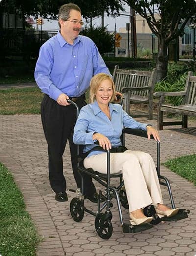 woman in a transport wheelchair
